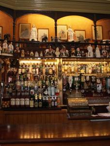 a bar with a lot of bottles on the shelf at Victoria inn in Durham