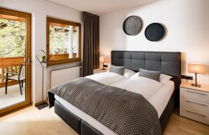 Postel nebo postele na pokoji v ubytování Hotel Brunnhofer
