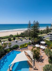 a view of the beach from the balcony of a resort at Oceana On Broadbeach in Gold Coast