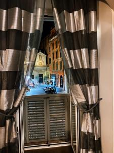 a window with a view of a city street at Casa Giorgia luxury apartment in Rome