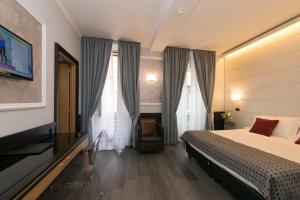 Postel nebo postele na pokoji v ubytování Duca d'Alba Hotel - Chateaux & Hotels Collection