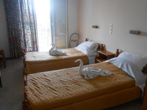 A bed or beds in a room at Akropolis studios