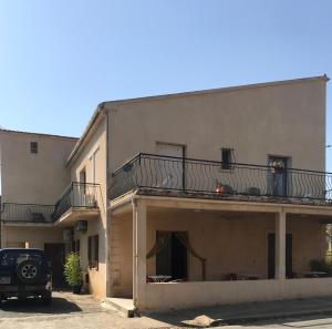 a building with a car parked in front of it at U Ricordu in Prunelli-di-Fiumorbo