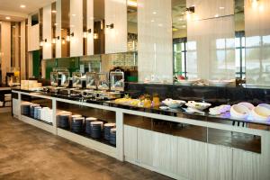 a buffet line in a restaurant with food on display at Grand Hotel Lili in Taitung City