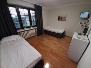 Posteľ alebo postele v izbe v ubytovaní Warszawska + 22 fotografií