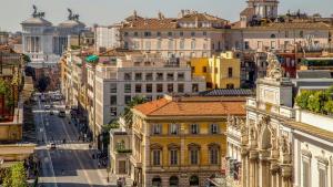 an aerial view of a city with buildings at Seven in Rome
