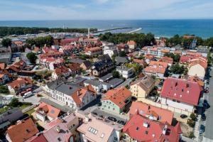 an aerial view of a town with red roofs at Apartamenty Rosa in Ustka