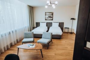 Postel nebo postele na pokoji v ubytování Žilvinas Hotel + 37 fotografií