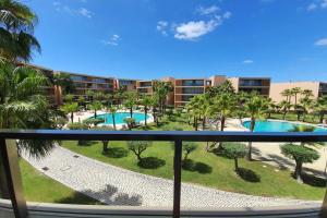 a view of the pool from the balcony of a resort at Ambassador Salgados Beach Suites in Albufeira