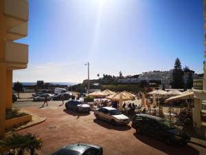 a group of cars parked in a parking lot at Armação de Pêra Praia Mar Sol in Armação de Pêra +35 photos