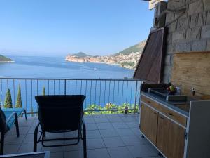 a balcony with a view of the water at Apartment and room Sveti Jakov in Dubrovnik