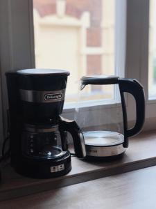 Príslušenstvo na prípravu kávy alebo čaju v ubytovaní MARIEN Apartment