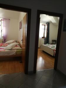 Postel nebo postele na pokoji v ubytování Apartment Nela