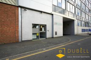 a building with a door open on a street at BEST VALUE !!! - The Cakide, Dubell Serviced Apartments Leeds, Up to 2 Guests, Ample Street Parking, Wifi & Netflix in Leeds