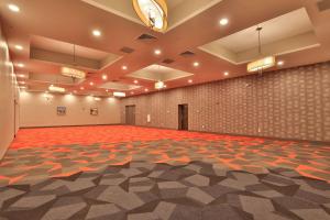 an empty room with a large hall with orange and white floors at Best Western Plus Executive Residency Nashville in Nashville +23 photos