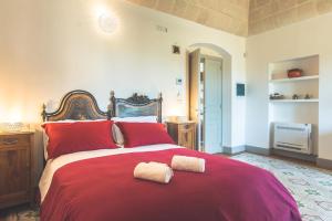 Postel nebo postele na pokoji v ubytování Masseria Gagliardi