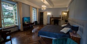 Ένα ή περισσότερα κρεβάτια σε δωμάτιο στο Le Clos Cathala Chambres d'Hôtes