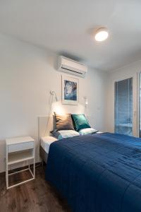 Posteľ alebo postele v izbe v ubytovaní Marina Apartman Hotel + 37 fotografií