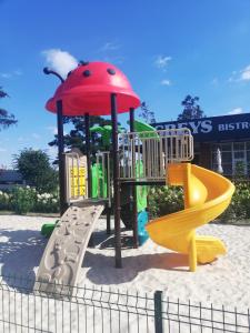 a playground with a slide at Hotel Greys Polonia in Zasutowo