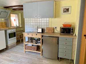 Kuchyň nebo kuchyňský kout v ubytování Ferienwohnung Pusteblume + 24 fotografií