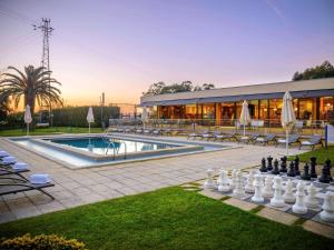 a large chess board in the yard of a building at Novotel Porto Gaia in Vila Nova de Gaia
