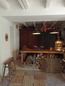 a room with a table and a woodburning stove at Marakasa B&B in Sant Antoni de Calonge