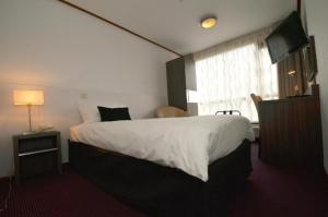 Postel nebo postele na pokoji v ubytování Hotel Faber