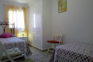 Posteľ alebo postele v izbe v ubytovaní Fabulosa casa de Vacaciones junto al mar
