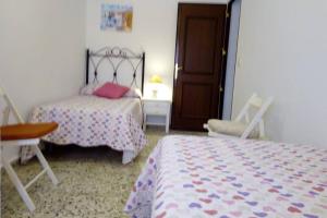 Posteľ alebo postele v izbe v ubytovaní Fabulosa casa de Vacaciones junto al mar
