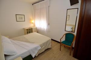 Postel nebo postele na pokoji v ubytování Hotel San Giuliano