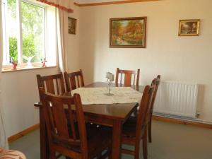 a dining room with a table and chairs at West Point B&B in Bude
