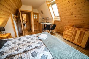 Posteľ alebo postele v izbe v ubytovaní Apartament Stary Mlyn