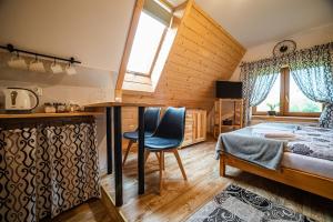 Posteľ alebo postele v izbe v ubytovaní Apartament Stary Mlyn