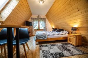 Posteľ alebo postele v izbe v ubytovaní Apartament Stary Mlyn
