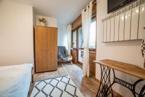 Posteľ alebo postele v izbe v ubytovaní Apartament Stary Mlyn