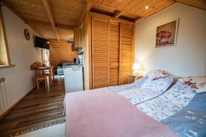 Posteľ alebo postele v izbe v ubytovaní Apartament Stary Mlyn