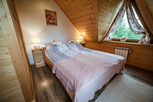 Posteľ alebo postele v izbe v ubytovaní Apartament Stary Mlyn
