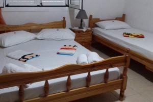 Postel nebo postele na pokoji v ubytování Yria Suite Zakynthos