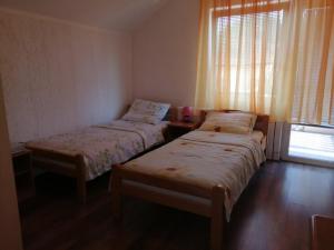 A bed or beds in a room at Apartmani Popovic