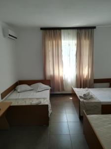 Postel nebo postele na pokoji v ubytování vila CALIL