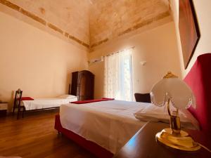 Postel nebo postele na pokoji v ubytování B&B Porta Grande