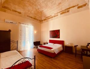 Postel nebo postele na pokoji v ubytování B&B Porta Grande