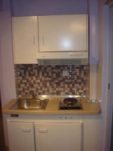 a kitchen with a sink and a counter top at Barbara Studios in Skala Potamias