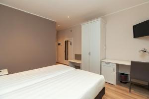 Ένα ή περισσότερα κρεβάτια σε δωμάτιο στο Er Mirin - Il Mulino di Carcare Hotel