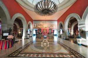 a large room with a large chandelier in a building at Europe Villa Cortes GL in Playa de las Americas