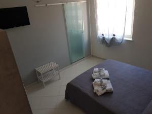 Postel nebo postele na pokoji v ubytování B&b regina del porto