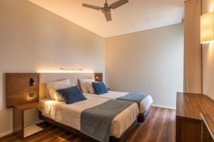 Postel nebo postele na pokoji v ubytování Hotel Girassol - Suite Hotel + 37 fotografií