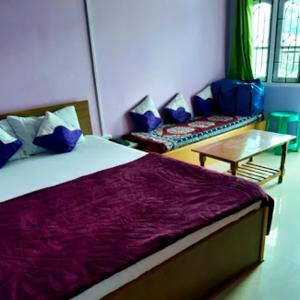 En eller flere senger på et rom på Orchid Lodge kalimpong