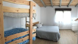 a bedroom with two bunk beds and a bed at Ak-55 Rural House in Villaviciosa +94 photos