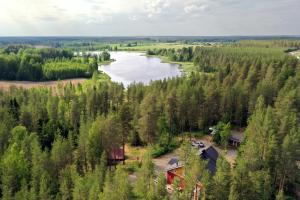 an aerial view of a river and a house at Karkausmäen Kammari in Kinnula